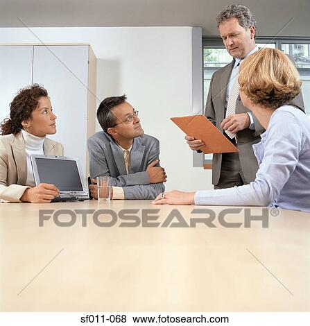 Stock Photo - Businesspeople in office. Fotosearch