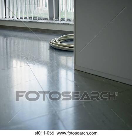 Stock Photography - Coiled cable on floor. Fotosearch
