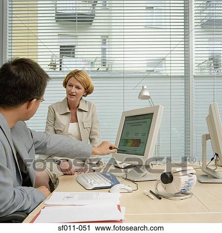 Stock Image - Colleagues in office. Fotosearch
