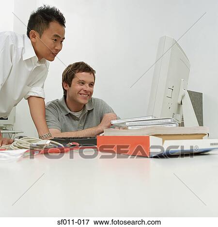 Office colleagues smiling View Large Photo Image Stock Photo - Office colleagues smiling. Fotosearch