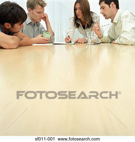 Office workers in meeting View Large Photo Image Stock Image - Office workers in meeting. Fotosearch
