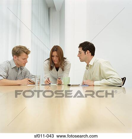 Office workers in meeting View Large Photo Image Stock Image - Office workers in meeting. Fotosearch