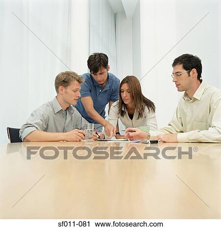 Office workers in meeting View Large Photo Image Stock Image - Office workers in meeting. Fotosearch