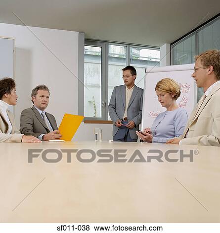 Office workers in meeting View Large Photo Image Stock Photo - Office workers in meeting. Fotosearch