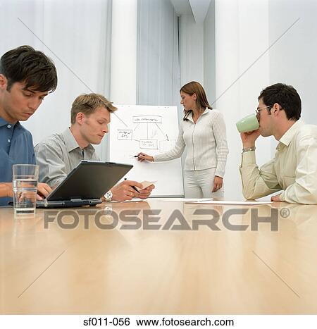 Office workers in meeting View Large Photo Image Stock Photograph - Office workers in meeting. Fotosearch