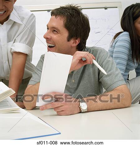 Office workers laughing View Large Photo Image Stock Photo - Office workers laughing. Fotosearch