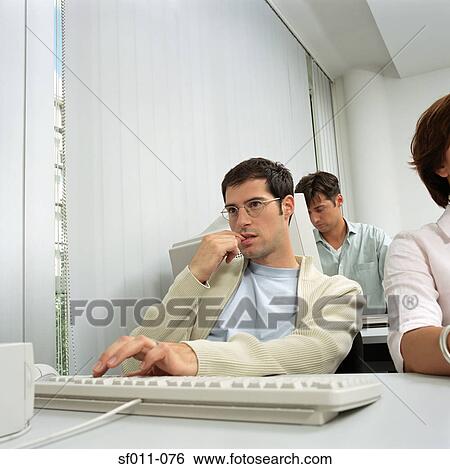 Stock Photograph - Office workers. Fotosearch
