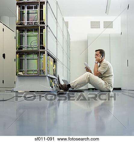 Technician working on server View Large Photo Image Stock Image - Technician working on server. Fotosearch