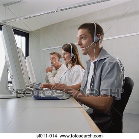 Three call centre operators View Large Photo Image Picture - Three call centre operators. Fotosearch