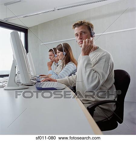 Three call centre operators View Large Photo Image Stock Image - Three call centre operators. Fotosearch
