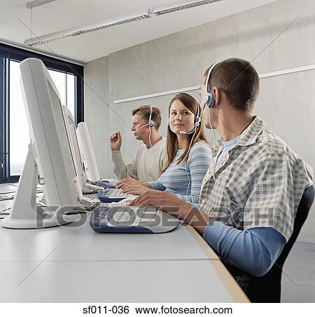 Three call centre operators View Large Photo Image Stock Photograph - Three call centre operators. Fotosearch