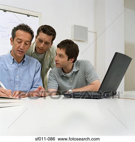 Three male office workers View Large Photo Image Stock Photograph - Three male office workers. Fotosearch