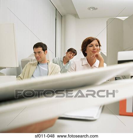 Three office workers View Large Photo Image Stock Photo - Three office workers. Fotosearch
