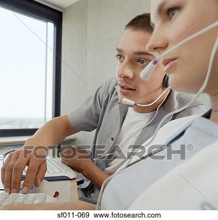 Two call centre operators View Large Photo Image Stock Photo - Two call centre operators. Fotosearch