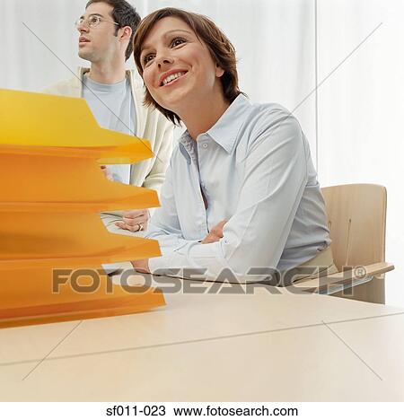 Stock Image - Two office workers. Fotosearch