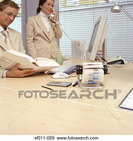 Two office workers View Large Photo Image Stock Photo - Two office workers. Fotosearch