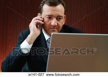 Businessman at work View Large Photo Image Stock Photo - Businessman at work. Fotosearch