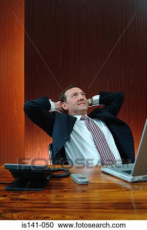 Stock Image - Businessman in boardroom. Fotosearch