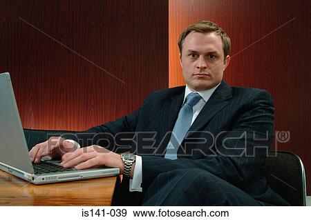 Stock Photo - Businessman in boardroom. Fotosearch