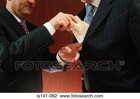 Stock Image - Businessman makes cash deal. Fotosearch
