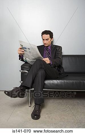 Businessman reading newspaper View Large Photo Image Stock Image - Businessman reading newspaper. Fotosearch