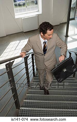 Picture - Businessman running late. Fotosearch