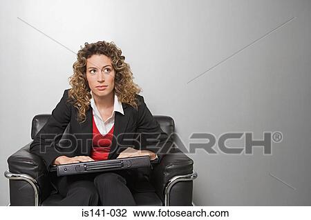 Businesswoman in an armchair View Large Photo Image Stock Image - Businesswoman in an armchair. Fotosearch
