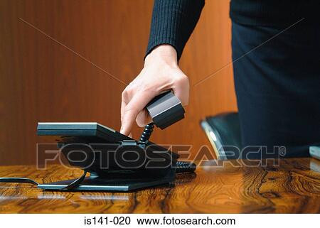 Stock Image - Businesswoman making a call. Fotosearch