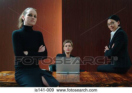 Stock Photo - Businesswomen in boardroom. Fotosearch