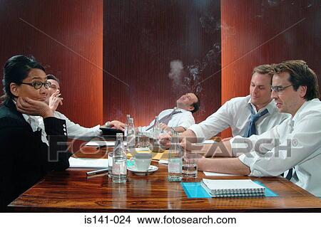 Smoking in boardroom meeting View Large Photo Image Picture - Smoking in boardroom meeting . Fotosearch