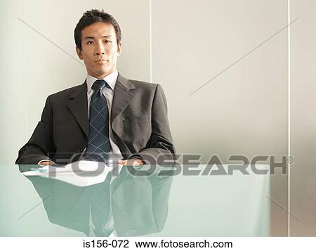 Businessman at table View Large Photo Image Stock Image - Businessman at table. Fotosearch