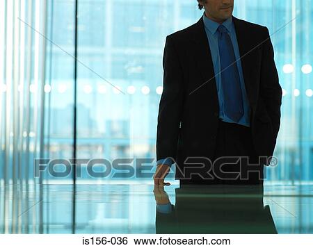 Businessman leaving meeting room View Large Photo Image Stock Photograph - Businessman leaving meeting room. Fotosearch