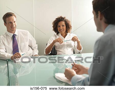 Colleagues having a meeting View Large Photo Image Stock Photography - Colleagues having a meeting. Fotosearch