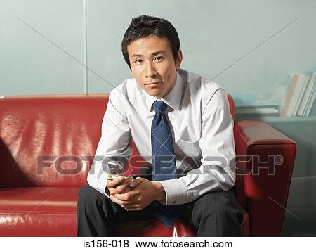 Office worker with mobile phone View Large Photo Image Stock Photo - Office worker with mobile phone. Fotosearch