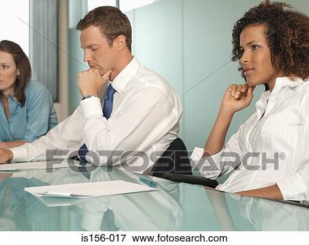 Office workers in a meeting View Large Photo Image Stock Photo - Office workers in a meeting. Fotosearch