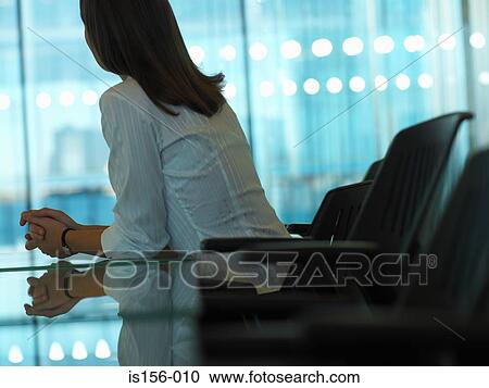 Woman in a meeting room View Large Photo Image Stock Image - Woman in a meeting room. Fotosearch
