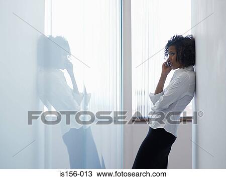 Woman using mobile phone View Large Photo Image Stock Image - Woman using mobile phone. Fotosearch