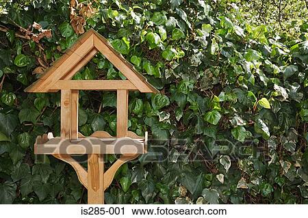 Stock Image - Birdhouse in a garden. Fotosearch