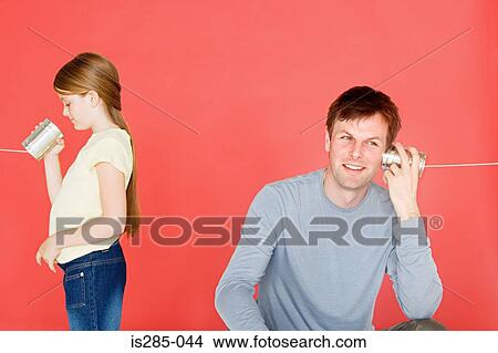 Father and daughter with tin can phone View Large Photo Image Picture - Father and daughter with tin can phone. Fotosearch