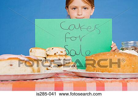 Girl with cake stall View Large Photo Image Stock Image - Girl with cake stall. Fotosearch