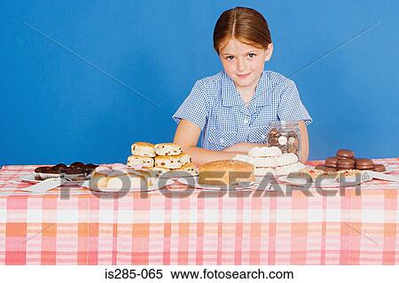 Girl with cake stall View Large Photo Image Stock Photography - Girl with cake stall. Fotosearch