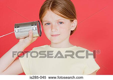 Girl with tin can phone View Large Photo Image Stock Photography - Girl with tin can phone. Fotosearch