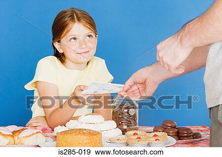 Stock Photo - Man buying cake from girl. Fotosearch