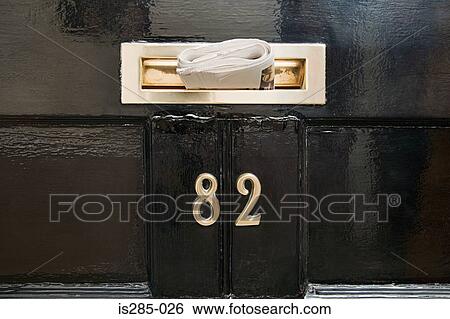 Stock Photograph - Newspaper in letterbox. Fotosearch