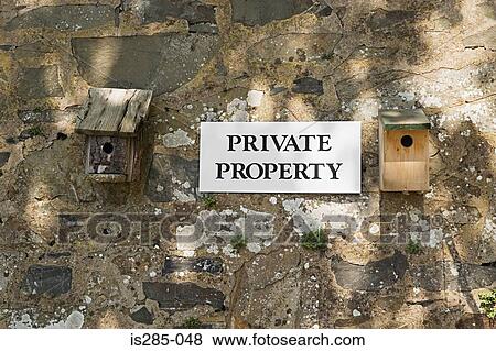Stock Photo - Private property sign by birdhouses. Fotosearch