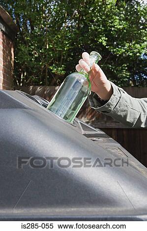 Stock Photography - Recycling a wine bottle. Fotosearch