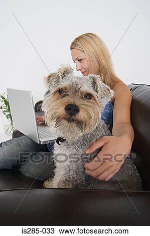 Woman with laptop and pet dog View Large Photo Image Stock Image - Woman with laptop and pet dog. Fotosearch