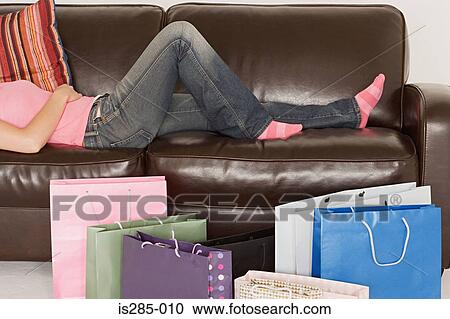 Stock Image - Woman with shopping bags. Fotosearch