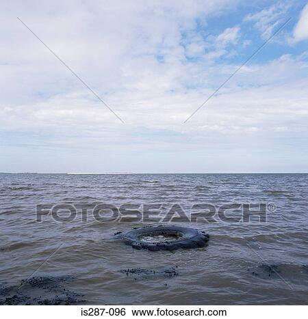 Tyre floating in the sea View Large Photo Image Stock Photograph - Tyre floating in the sea. Fotosearch