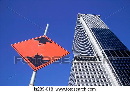 Road sign and skyscraper View Large Photo Image Stock Photo - Road sign and skyscraper. Fotosearch